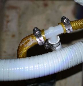 T connector in sink drain.  The small-diameter white hose leads to the toilet intake.