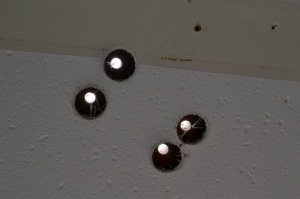 I drilled 7/8" access holes where each fastener hole came through.  I had considered obtaining white plastic cover buttons for these holes, but there are too many of them.  I will cover them with either a teak plate from scrap, or a cover plate from some kind of white plastic.  I'm leaning toward the teak.