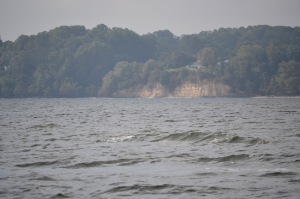 The cliffs, where I anchor in shallow water and scrub the growth off the bottom. I can anchor in about 4 feet and stand beside the boat brushing the growth off.